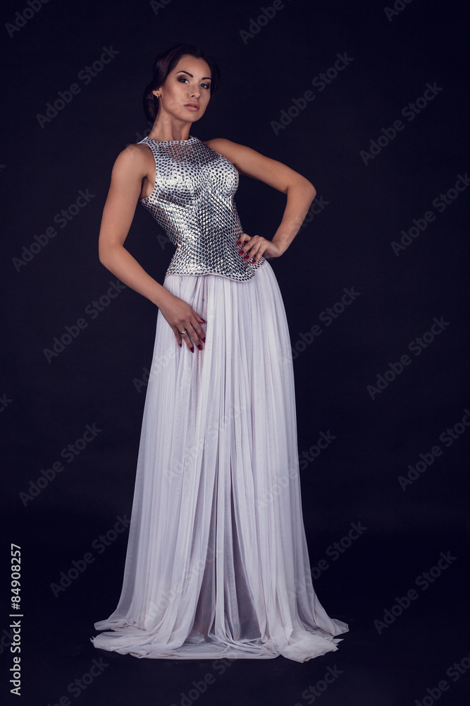 Pretty sexy girl full length posing in a fashion dress Pretty sexy girl full length posing in a fashion dress