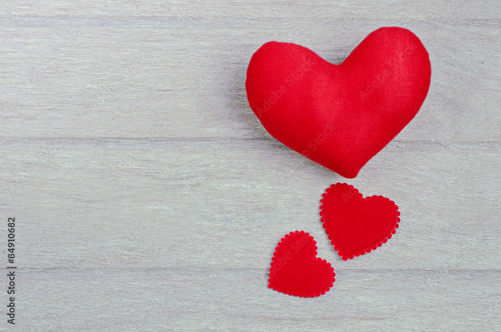 red heart shape on wood background red heart shape on wood background