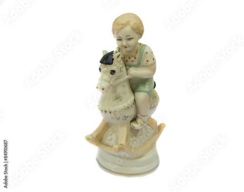 The boy on the horse, vintage porcelain figurine. Isolated on wh