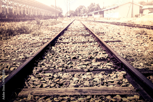 railway track in train station in vintage color filter
