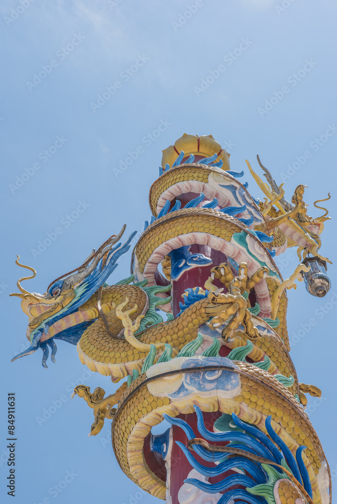 Fototapeta premium Colorful dragons statue on pole.