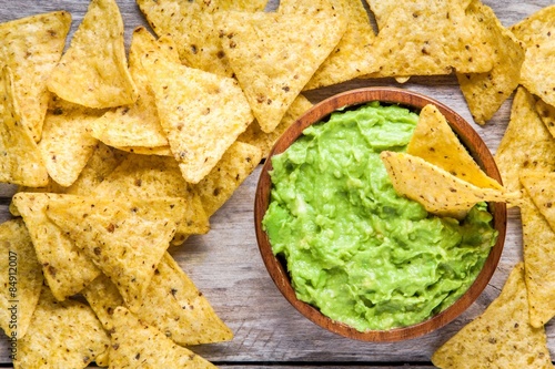 homemade guacamole with corn chips top view