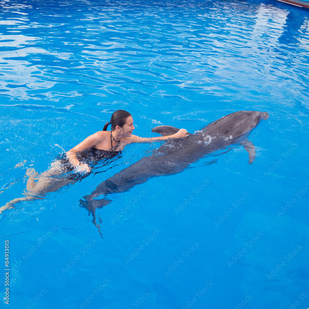 Girl swimming with Dolphin