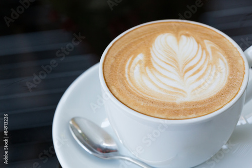 hot coffee latte, latte art with heart in a white cup