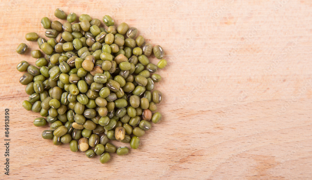 Mung beans on wooden board