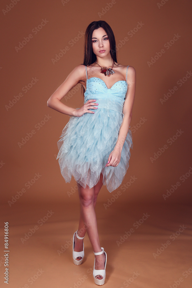 Naklejka premium woman with dark hair and evening makeup. Jewelry and Beauty.