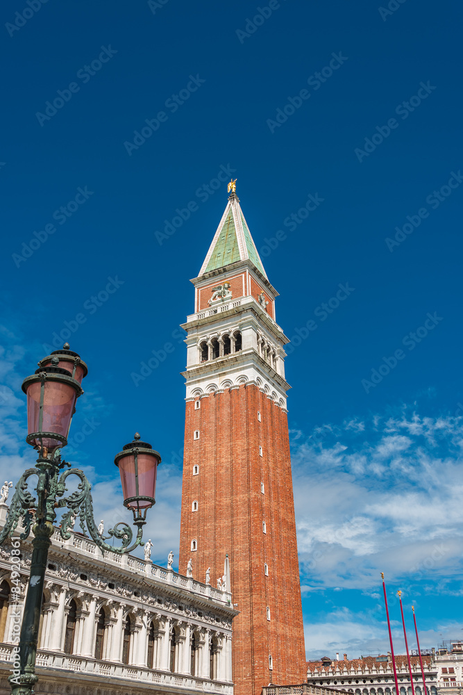 Campanile tower at Piazza San Marco and gondolers, Venice, Italy