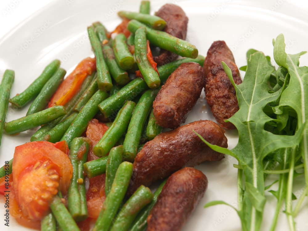 fried merguez sausages with green beans, tomatoes and fresh rocket fried merguez sausages with green beans, tomatoes and fresh rocket