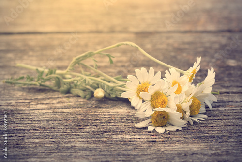 Fototapeta Naklejka Na Ścianę i Meble -  Photo of white flowers on wooden background