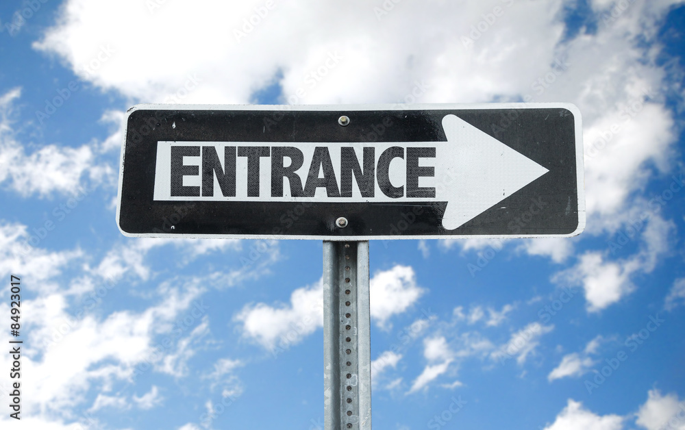 Fototapeta premium Entrance direction sign with sky background