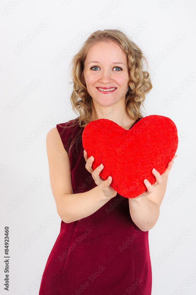 Charming woman standing with red heart Charming woman standing with red heart