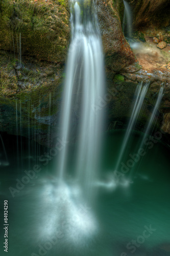 Small waterfall in river Soca gorges in Slovenian Alps Central E