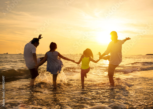 happy family enjoy summer vacation on the beach