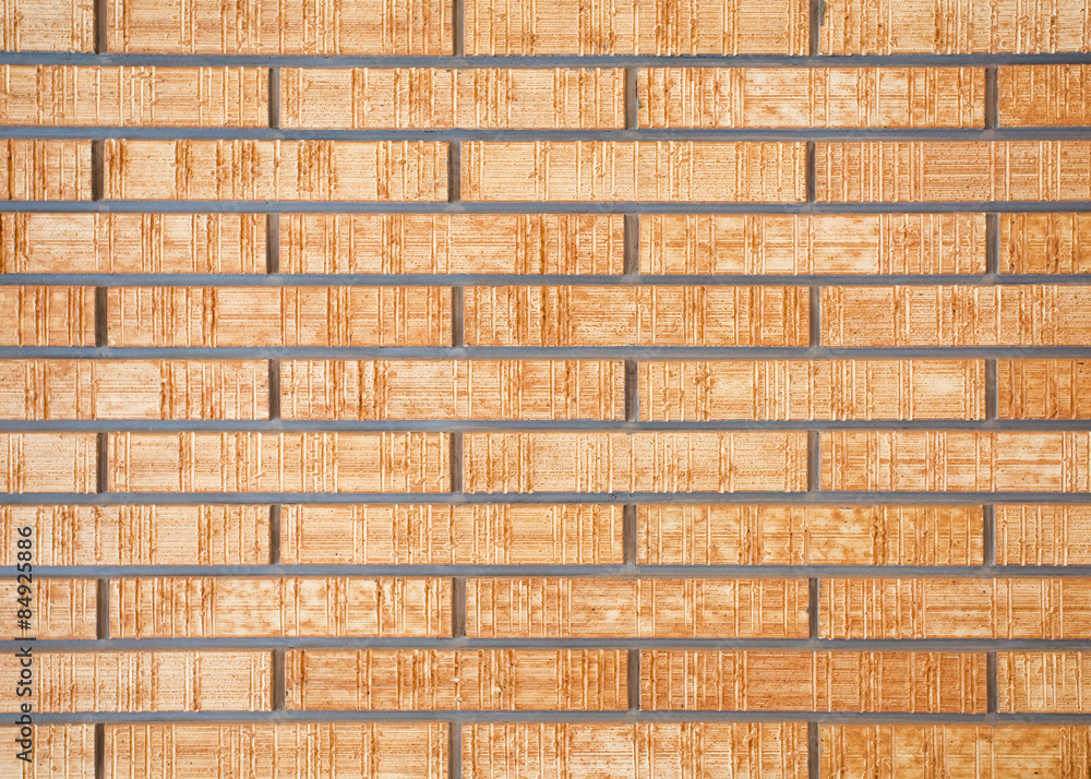 Fototapeta premium Brown brick stone wall seamless background and texture