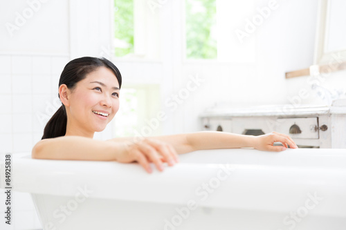 young asian woman in bathroom
