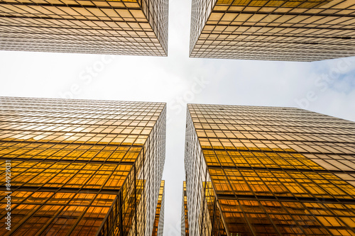 low angle view of modern skyscraper exterior and sky