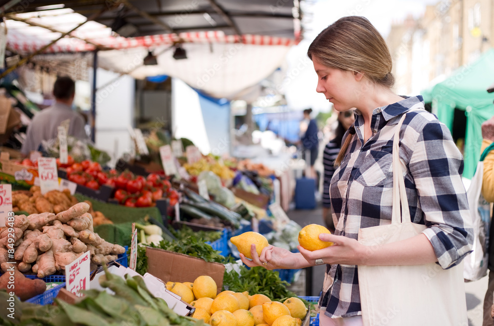 young woman at the market shopping