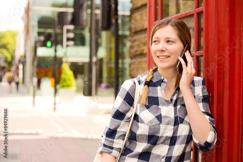 Photography young woman making a phone call in london
