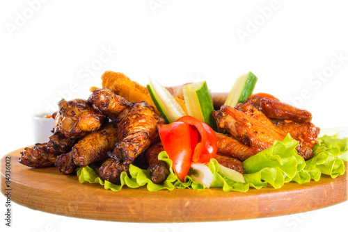 Fried chicken wings with vegetables 