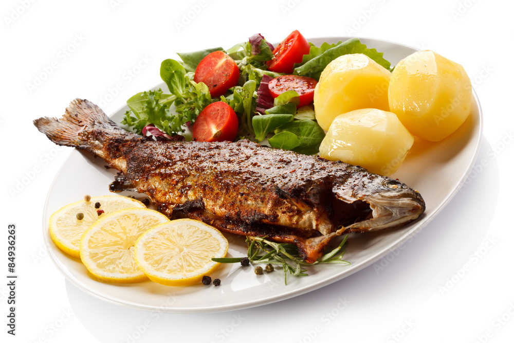 Fish dish - fried fish fillet with vegetables Fish dish - fried fish fillet with vegetables