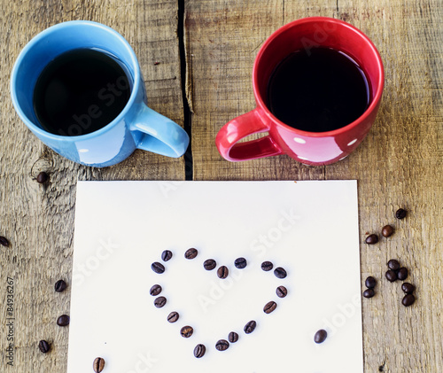 two polka dot mugs and sheet of paper with message