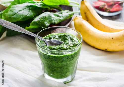 Green smoothie with spinach, kiwi, mint and banana, summer