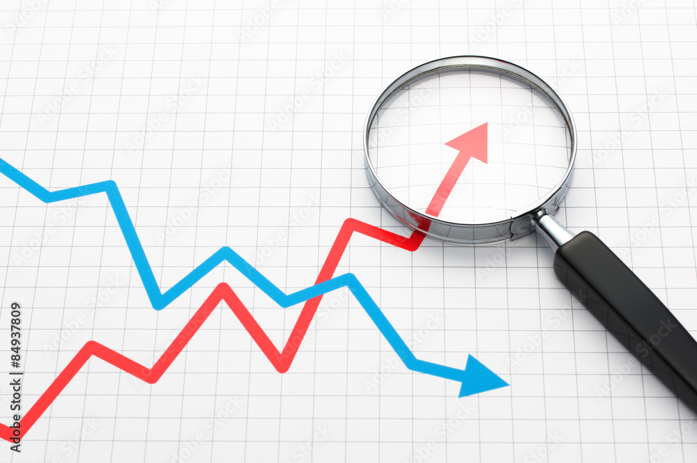 Line graph and magnifying glass. Line graph and magnifying glass.