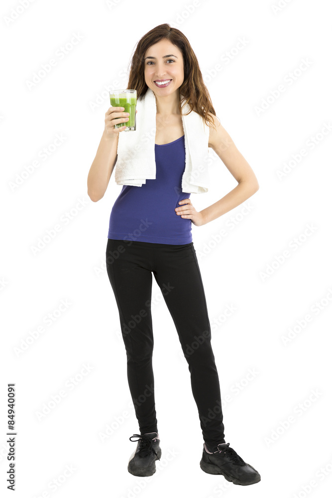 Fitness woman with a glass of green smoothie, full length Fitness woman with a glass of green smoothie, full length