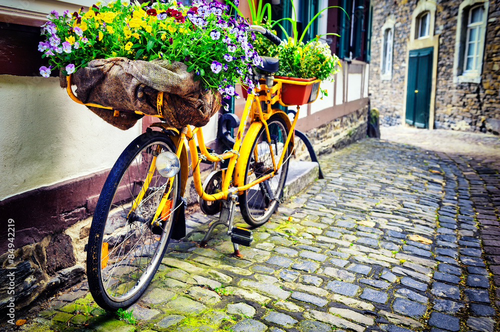 Old rusty bicycle with flowers