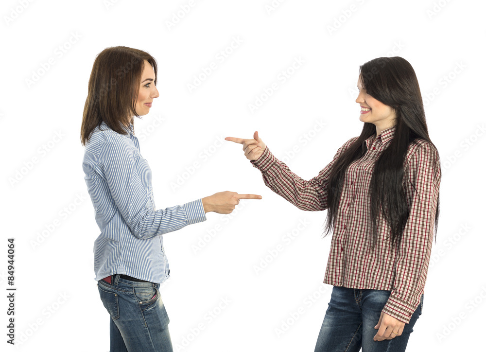 Two young girls pointing towards each other.
Casual dress shirt jeans women pointing hands to counterpart on white background Two young girls pointing towards each other.
Casual dress shirt jeans women pointing hands to counterpart on white background