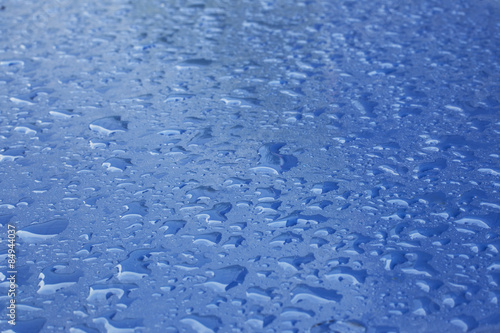 pattern of raindrops on blue surface