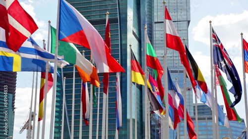 Flags of the different countries of the world against the business center photo