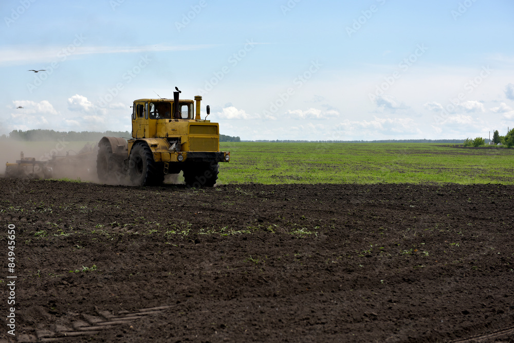 Tractor plowing a field