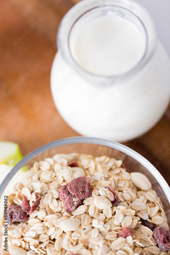 close up of bowl with granola or muesli on table close up of bowl with granola or muesli on table