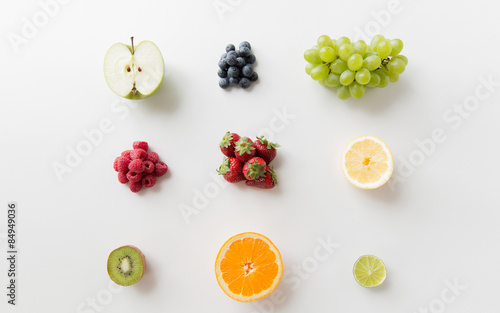 Fototapeta Naklejka Na Ścianę i Meble -  ripe fruits and berries on white surface