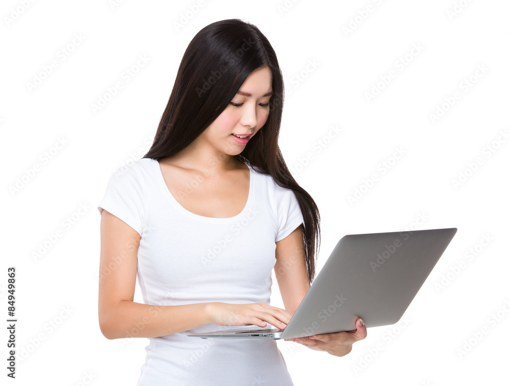 Young woman look at the laptop computer Young woman look at the laptop computer