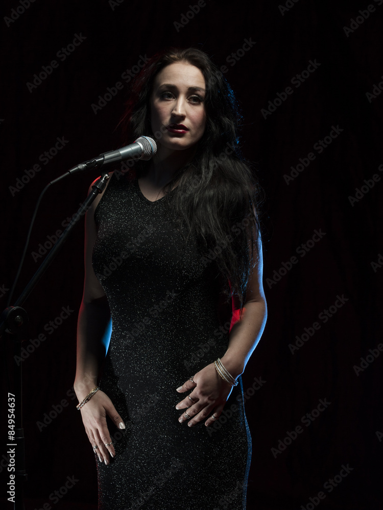 Fototapeta premium Beautiful female singer in studio