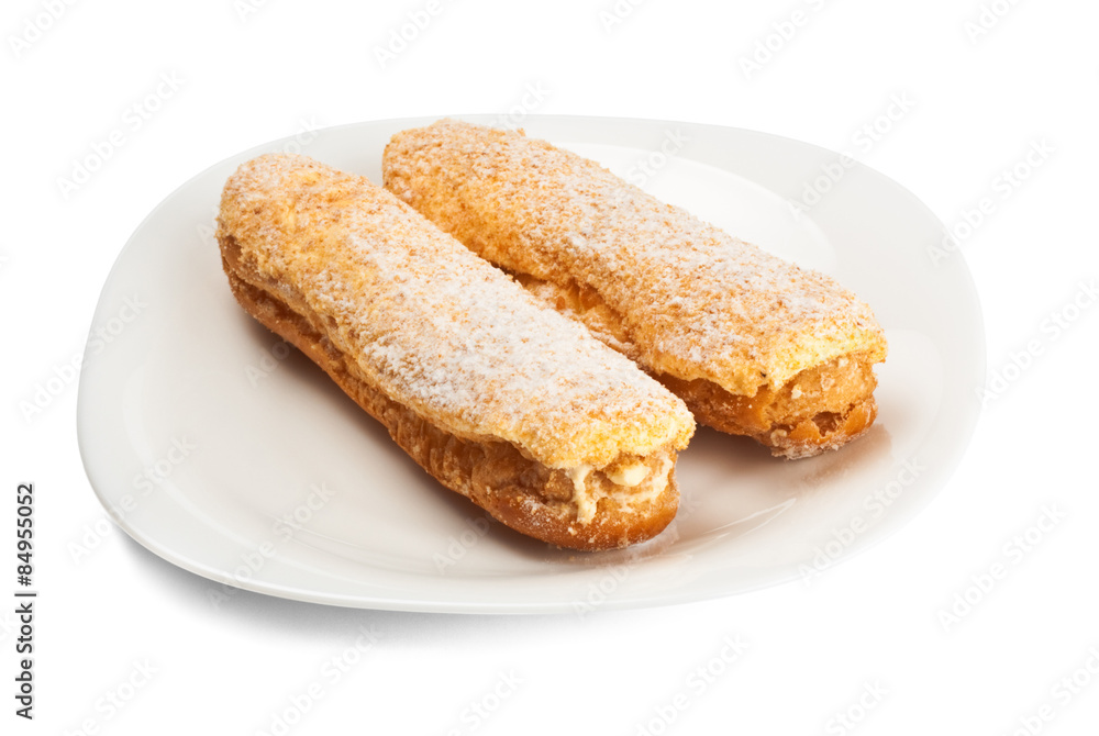 two tasty eclairs on dish