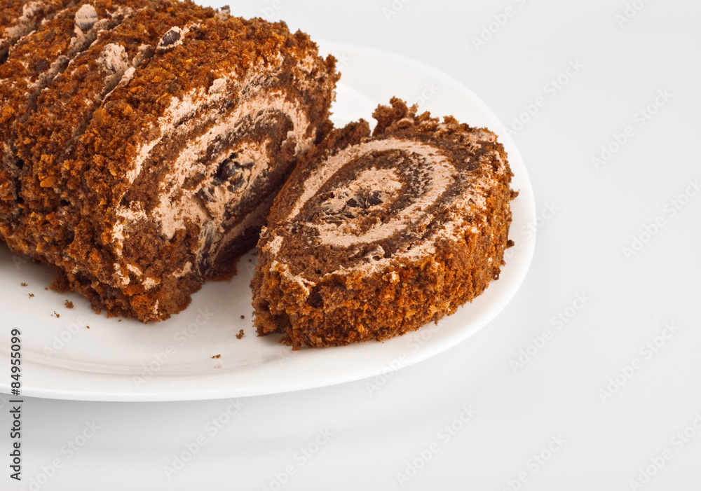 sliced chocolate roll on white dish