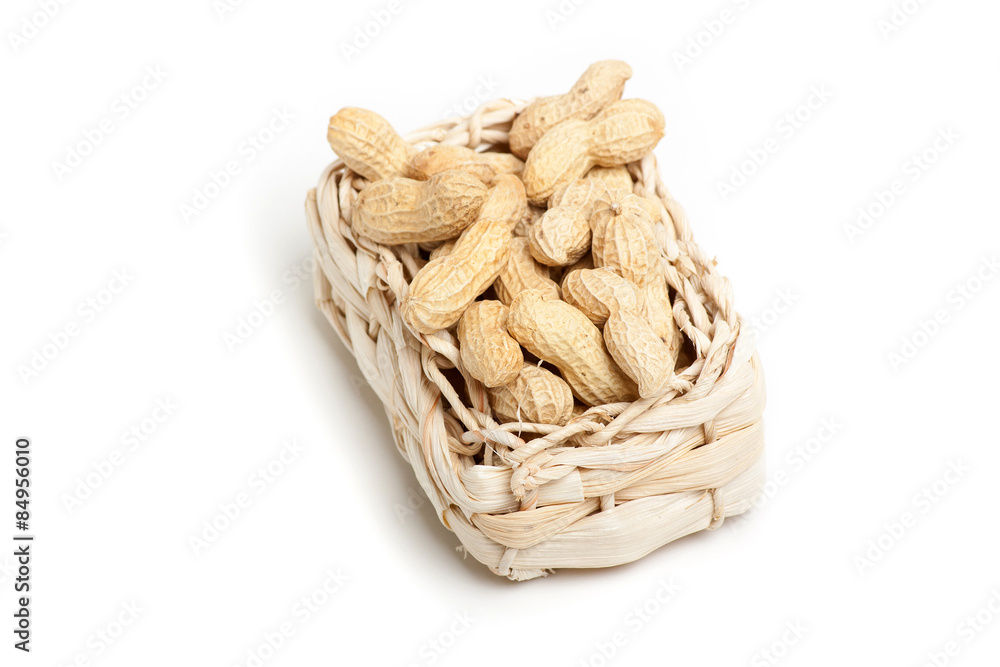 peanuts isolated in basket on white background peanuts isolated in basket on white background