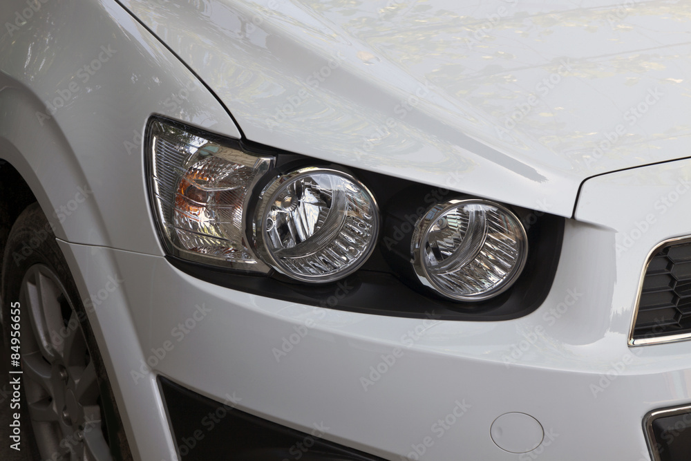 the right headlight of a car the right headlight of a car