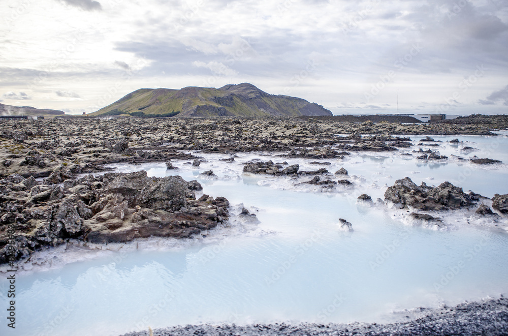 The lagoon is a man-made lagoon which is fed by the water output of the nearby geothermal power plant Svartsengi The lagoon is a man-made lagoon which is fed by the water output of the nearby geothermal power plant Svartsengi