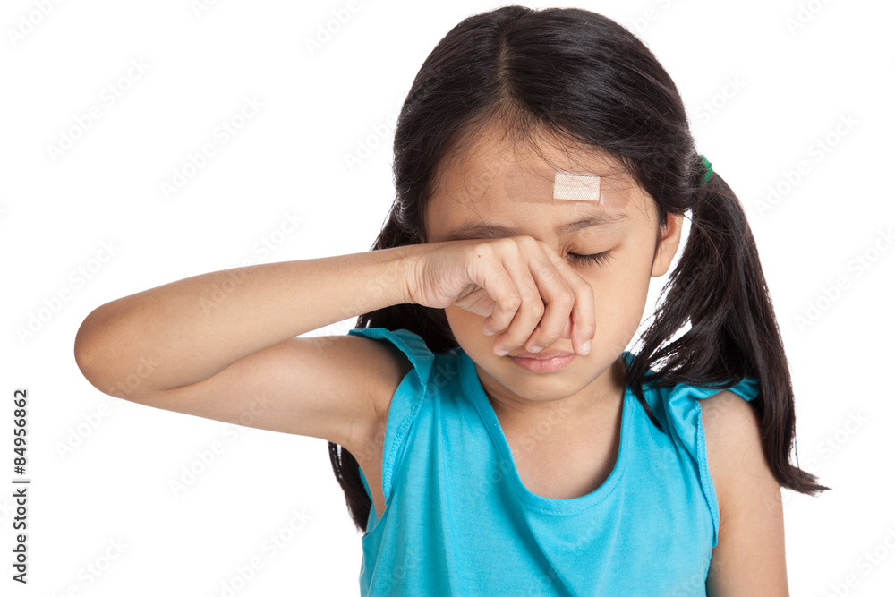 Little asian girl cry with bandage on forehead Little asian girl cry with bandage on forehead