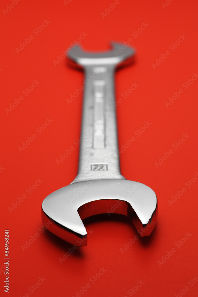 spanner on red background spanner on red background