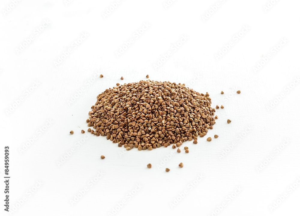 Brown buckwheat groats on white background Brown buckwheat groats on white background