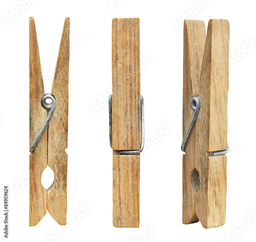 Set of three wooden cloth pegs isolated on white background