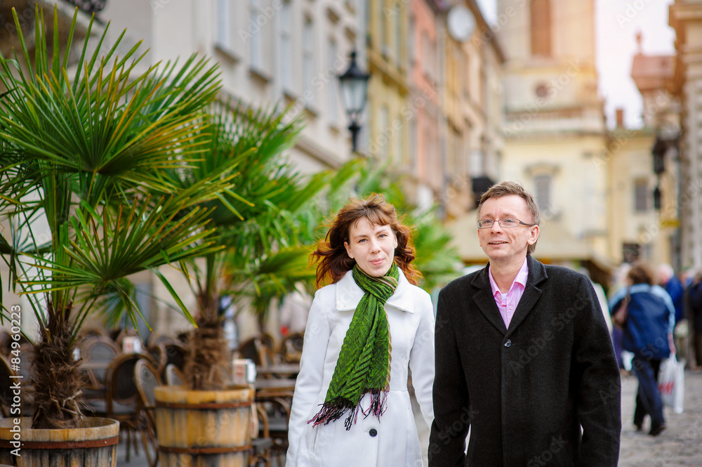 Fototapeta premium loving couple walking through the old Lviv
