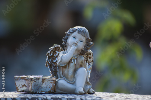 Angel watching over a tombstone.