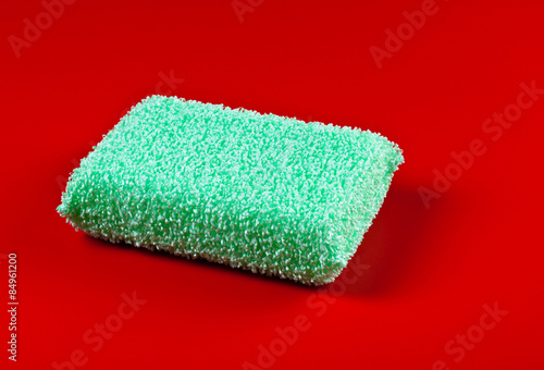 green sponge on red background