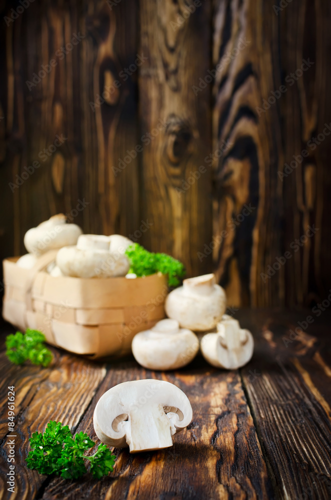 Сhampignons with parsley in a basket Сhampignons with parsley in a basket